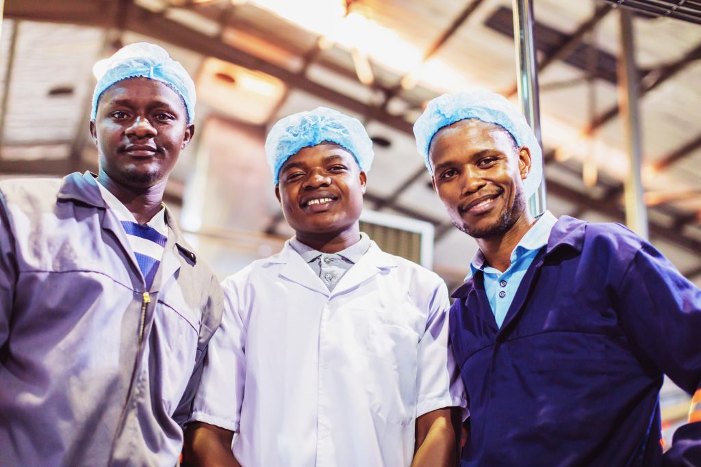 Africa, Quality, Worker - Production Line Workers looking at the camera for a portrait.